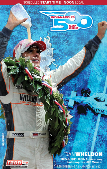 Wheldon pouring the traditional winner’s drink of milk over his head in Victory Lane