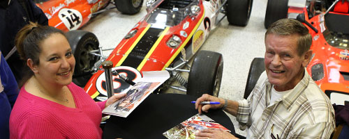 Bobby Unser signing autographs at IMS Museum