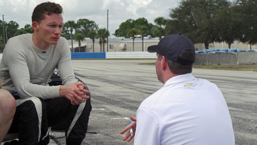 Mike Conway chats with a Chevy engineer at Sebring.