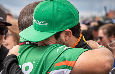 Kyle Kaiser hugs crewman