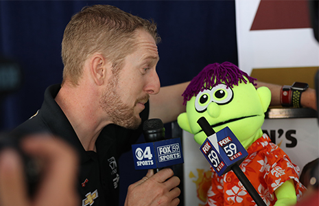 Charlie Kimball talks to puppet