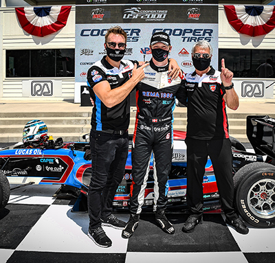 Jay Howard and driver Christian Rasmussen celebrate a win