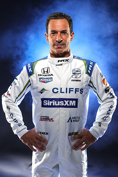 Helio Castroneves studio shot in his 2024 firesuit