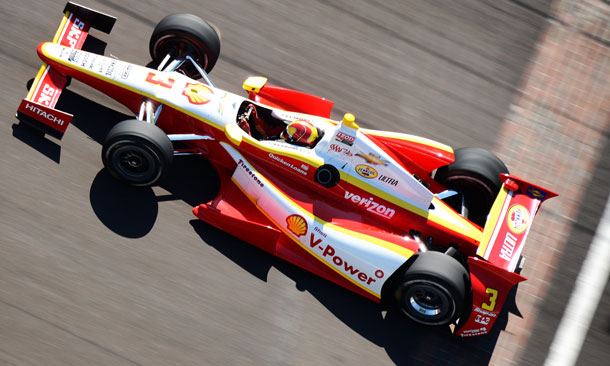 Helio Castroneves crosses the bricks at IMS