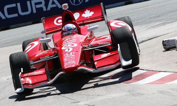 Scott Dixon hopping a curb