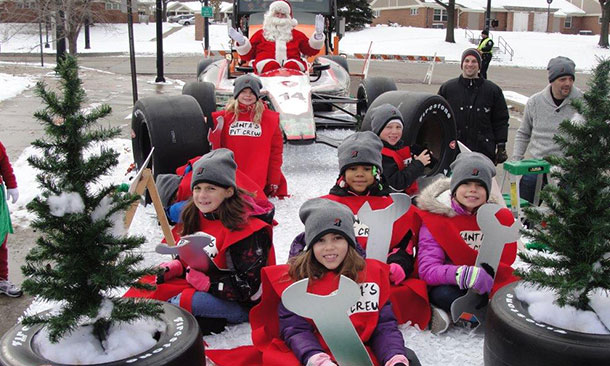 Santa Claus arrives with the Firestone Pit Crew