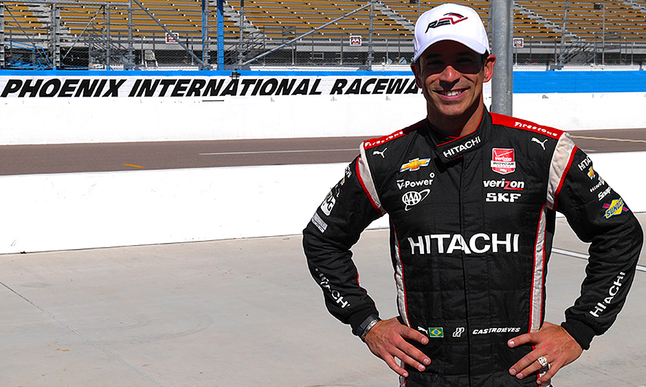 Helio Castroneves stands on pit lane at Phoenix International Raceway