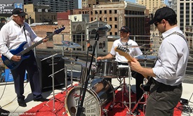 Thumbnail for Power shows off rooftop drum skills to rock classics