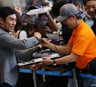 Sato humbled by hero's welcome in Japan