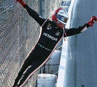Castroneves ends victory drought, climbs fence at Iowa