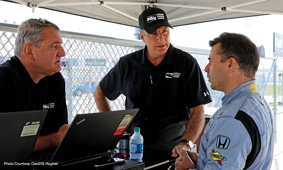 Test driver Oriol Servia with INDYCAR officials Tino Belli and Bill Pappas