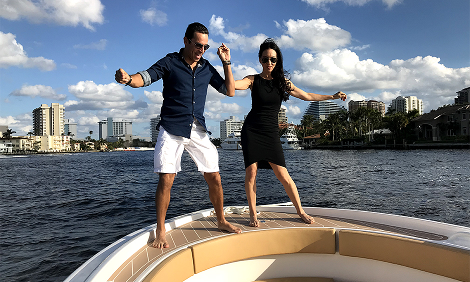 Helio Castroneves dancing on a both with Young Hollywood anchor Leslie Robbins.