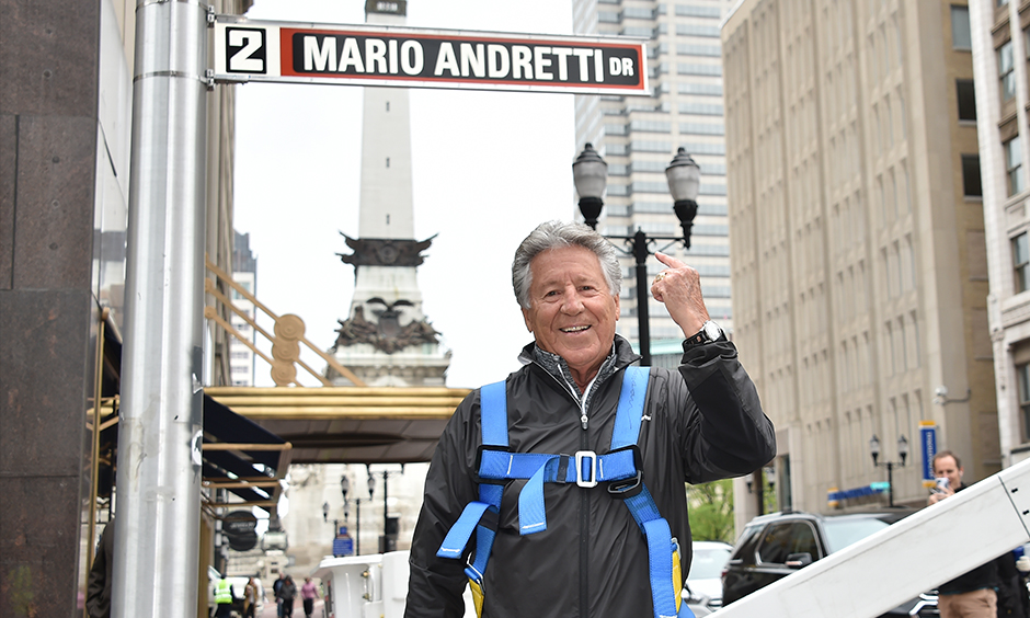 Mario Andretti with street sign