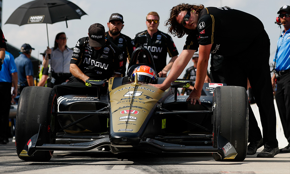 James Hinchcliffe's backup car being pushed into qualifying line