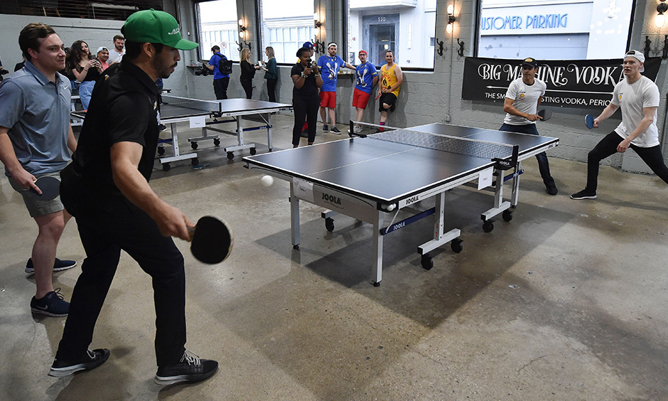 Kyle Kaiser, Helio Castroneves and Josef Newgarden playing ping poing