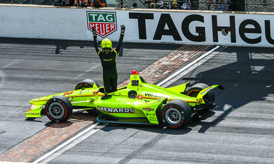 Simon Pagenaud celebrates on yard of bricks