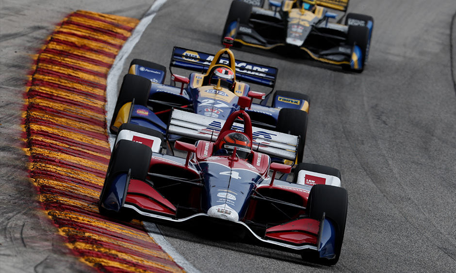 Matheus Leist, Alexander Rossi and Zach Veach on track Road America