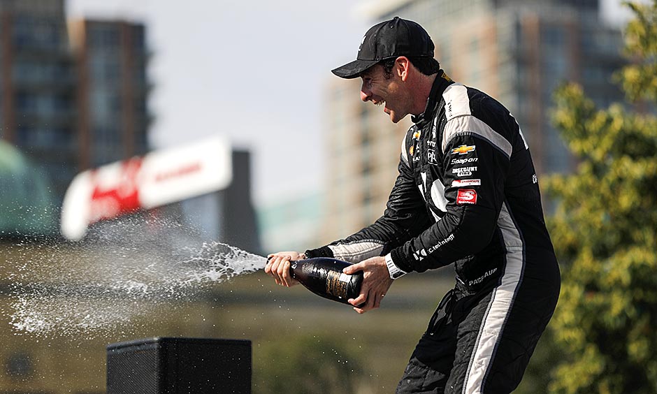 Simon Pagenaud sprays champagne